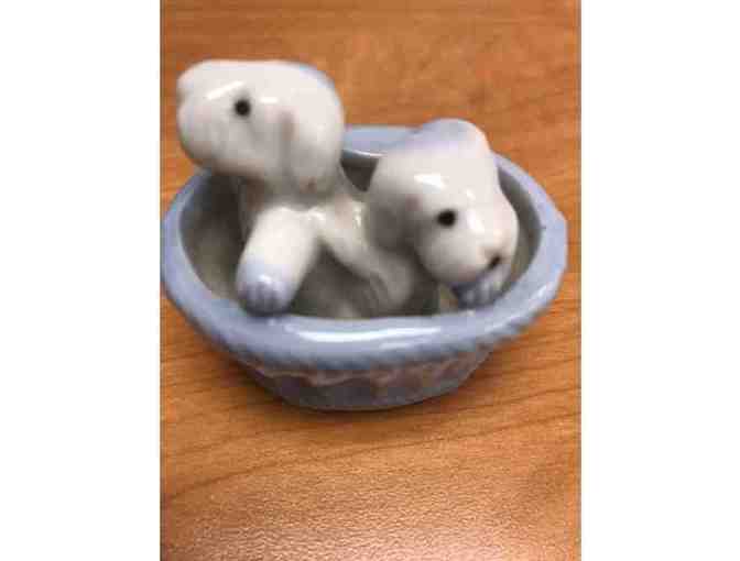Doggies in a basket figurine