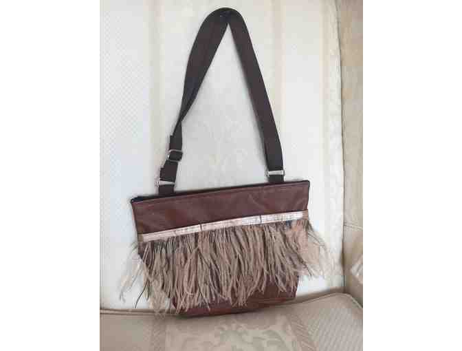 Vinyl Brown purse with a nice touch of feathers