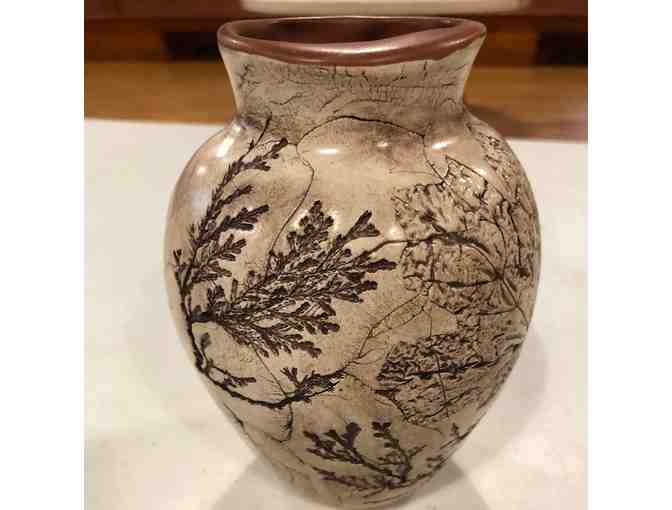 Handcrafted pottery vase with leaf designs