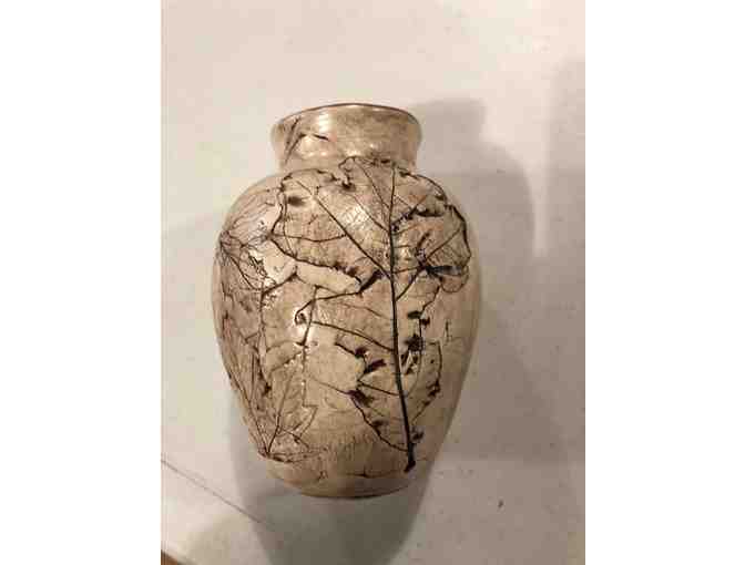 Handcrafted pottery vase with leaf designs