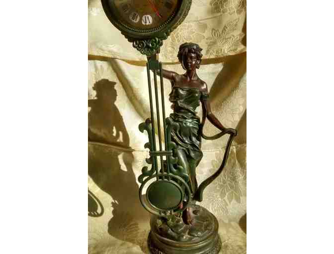 Charming working statuary clock