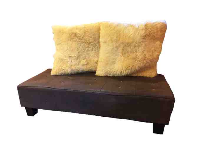 Vintage leather tufted bench/ottoman with sheepskin pillows