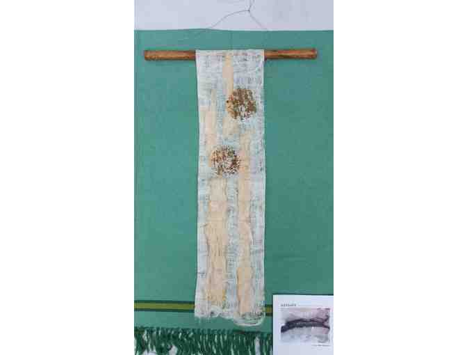 Fiber Wall Hanging and book by Artist in Residence Jacqueline Malllegni
