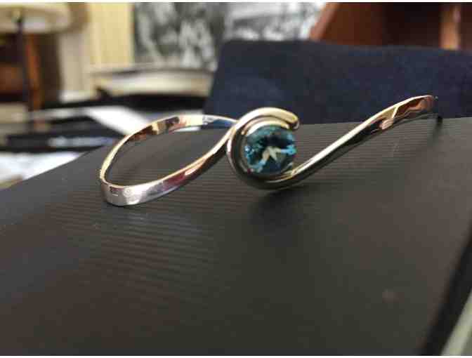 Hand forged sterling and blue topaz bracelet
