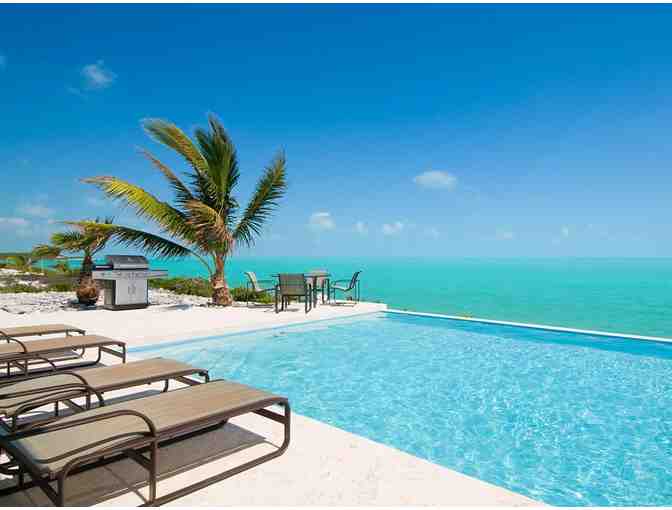5 Nights in a 2-Bedroom Beach House at PARROT CAY Resort in Turks & Caicos w/AIRFARE for 4