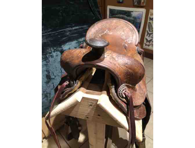 Vintage Western saddle with handcrafted tooled leather