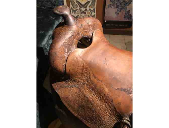 Vintage Western saddle with handcrafted tooled leather