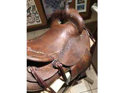 Vintage Western saddle with handcrafted tooled leather