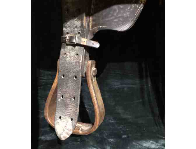 Vintage Western saddle with handcrafted tooled leather