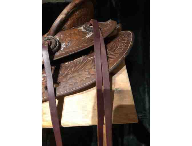 Vintage Western saddle with handcrafted tooled leather