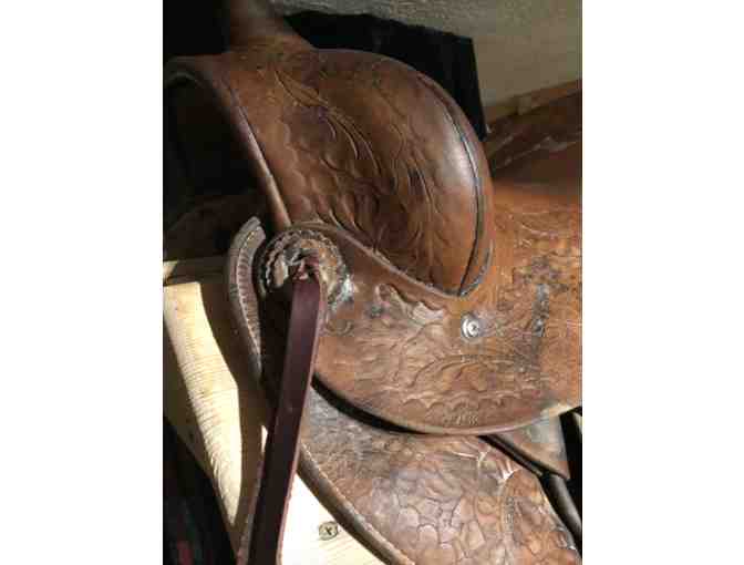 Vintage Western saddle with handcrafted tooled leather