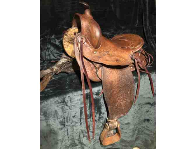 Vintage Western saddle with handcrafted tooled leather