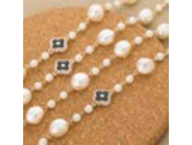 Long strand simulated pearl and rhinestone necklace