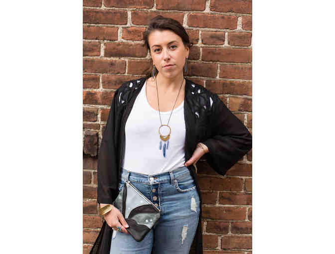 Handmade leather clutch bag by local artist