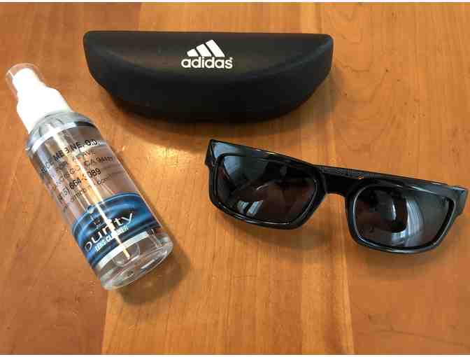 1 pair of Adidas Sunglasses + Lens Cleaner from L. Bruce Mebine, O.D.