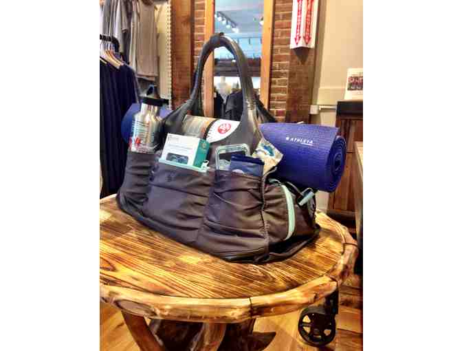 Manduka yoga mat and Athleta yoga bag full of goodies!