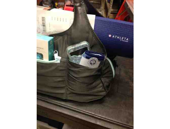 Manduka yoga mat and Athleta yoga bag full of goodies!