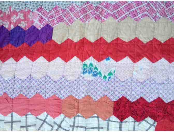 Beautiful vintage quilt with classic hexagon pattern