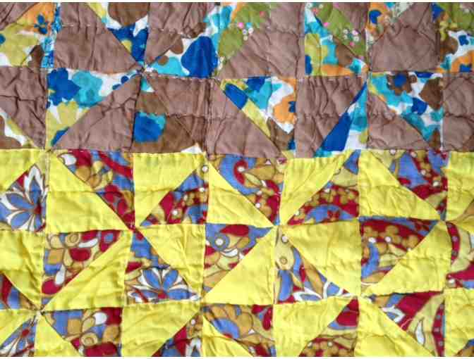 Beautiful hand-pieced vintage quilt with classic pinwheel pattern