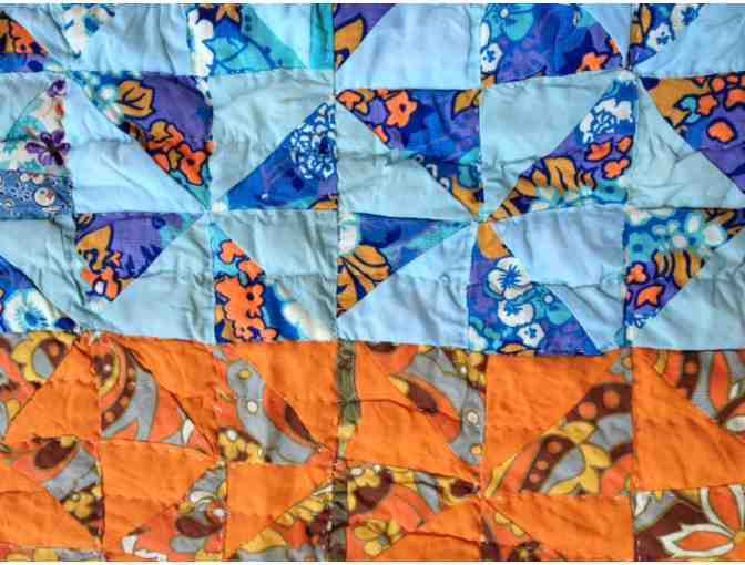 Beautiful hand-pieced vintage quilt with classic pinwheel pattern