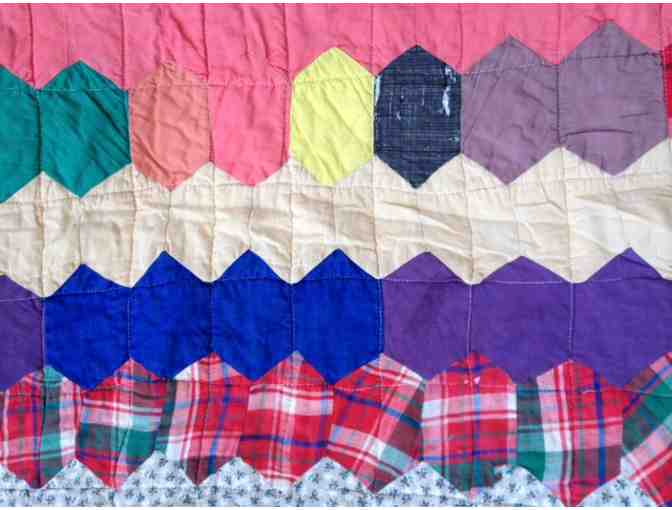 Beautiful vintage quilt with classic hexagon pattern