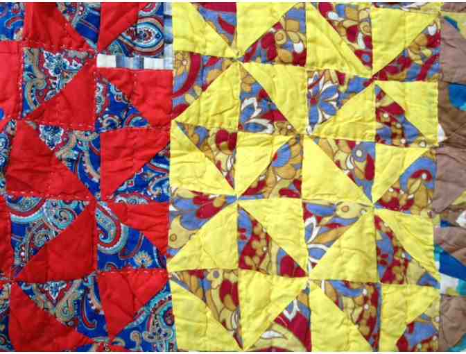 Beautiful hand-pieced vintage quilt with classic pinwheel pattern