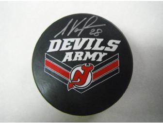 Autographed New Jersey Devils Puck by Kurtis Foster